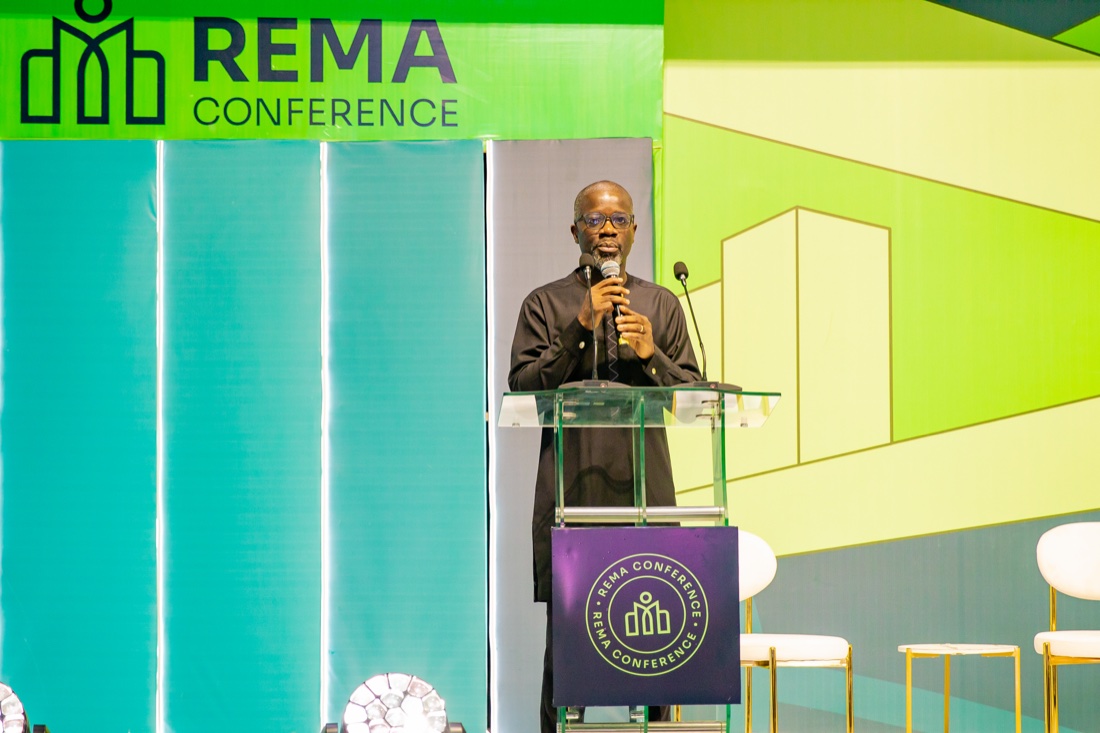 A keynote speaker at the REMA Conference lectern